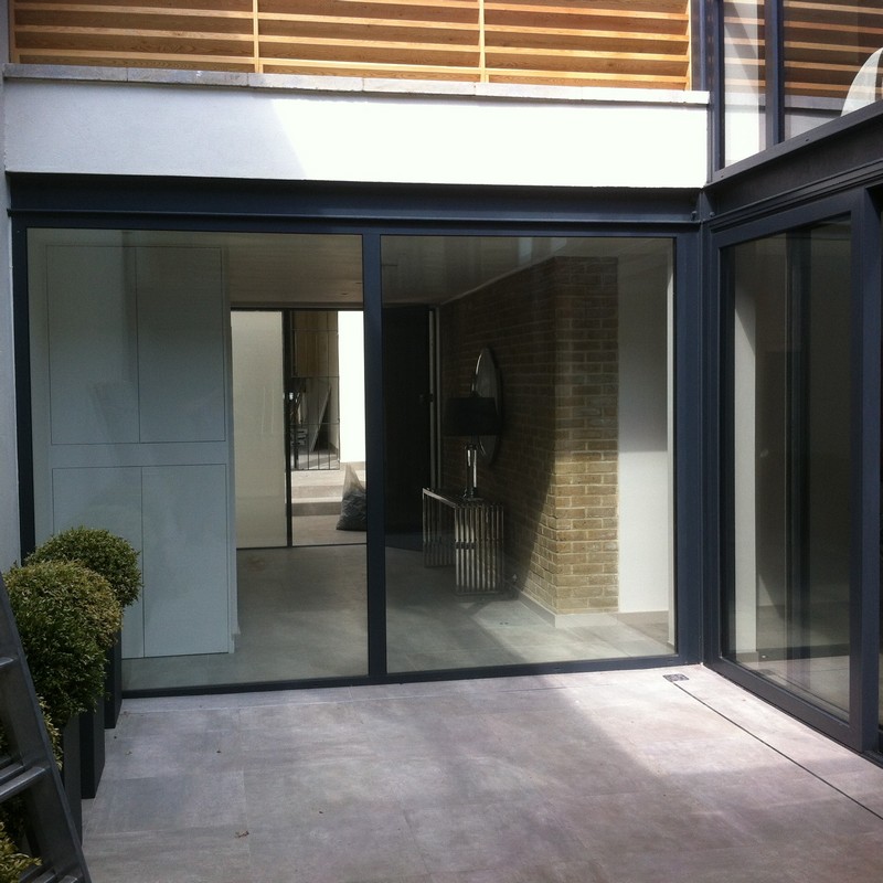 Floor-to-ceiling sliding doors opening to courtyard in Nine Elms