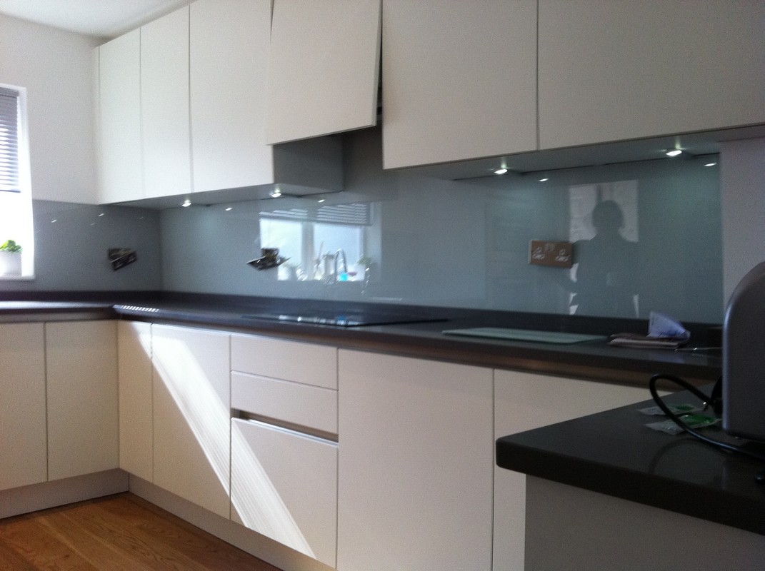 Grey glass kitchen splashback with LED lighting in Nine Elms