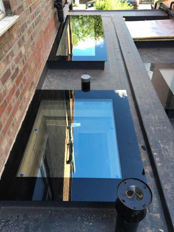 Multiple flat roof skylights on extension in Nine Elms